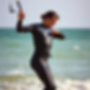 Ease of Wetsuit Wear for Kiteboarders A kiteboarder effortlessly putting on a wetsuit by the water's edge, emphasizing ease of wear.