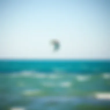 Kite in Action Above the Ocean A kite gliding through the air above azure waters