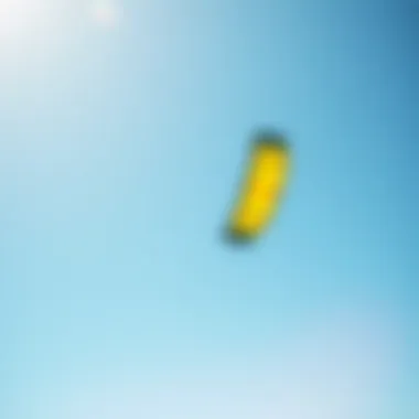 Dynamic Kite in Action A vibrant kitesurfing kite soaring in the sky against a clear blue backdrop, demonstrating its impressive design and maneuverability.