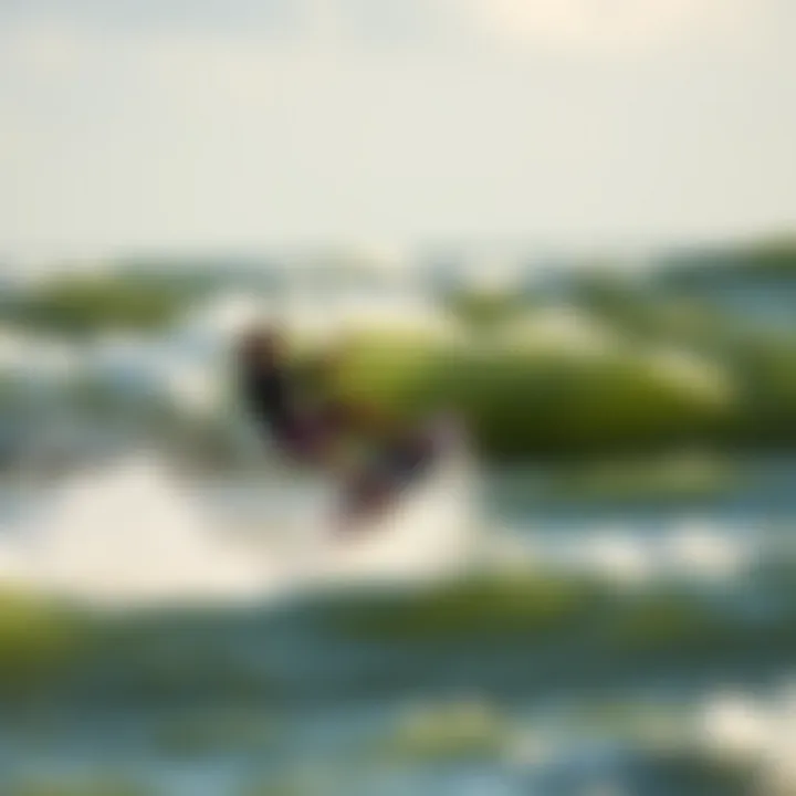 Dynamic Kiteboarding Action on Waves Kiteboarder executing a jump against a backdrop of waves