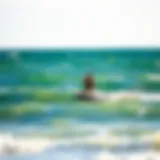 Kiteboarder gliding over the waves in Duck