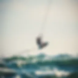 A kiteboarder soaring above the ocean waves, showcasing skill and freedom