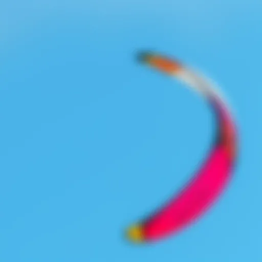 A vibrant kitesurfing kite soaring against a clear blue sky