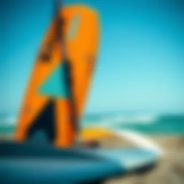 Close-up of budget-friendly kites and boards set against the ocean