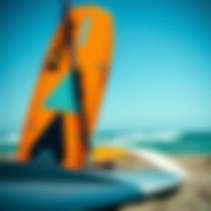 Close-up of budget-friendly kites and boards set against the ocean