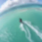 Stunning aerial view of a kiteboarder gliding over turquoise waters