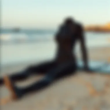 Evo wetsuit laid out on a sandy beach ready for water sports