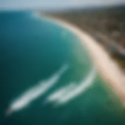 Aerial view of kiteboarding on a vibrant blue sea