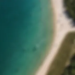 Aerial view of kiteboarders gliding over turquoise waters