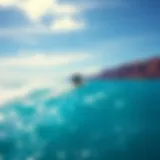 Kite surfer gliding over the turquoise waters of Maui