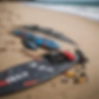 Essential Kite Surfing Gear A close-up of kite surfing gear including a kite, board, and safety equipment laid out on the beach.
