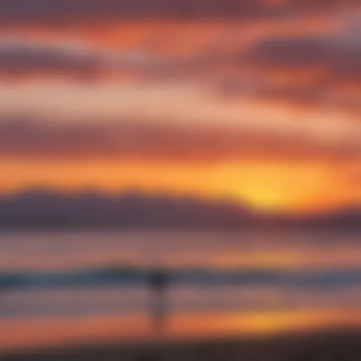 A scenic sunset over the Santa Barbara beach with kite surfers silhouetted against the colorful sky.