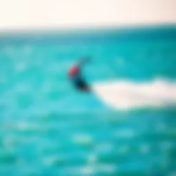 A vibrant kite soaring above turquoise waters during a kiteboarding session