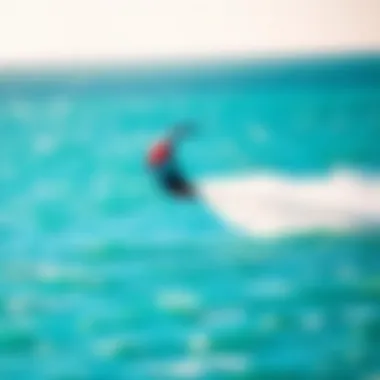 Kite in Flight Over Water A vibrant kite soaring above turquoise waters during a kiteboarding session