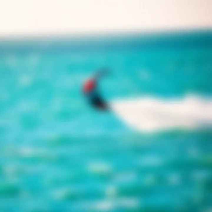 Kite in Flight Over Water A vibrant kite soaring above turquoise waters during a kiteboarding session