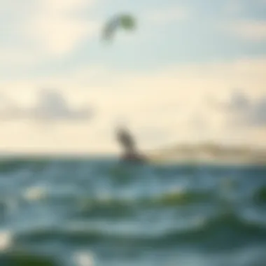 Kiteboarder Gliding Over Water An exhilarating moment of a kiteboarder gliding gracefully above the water surface