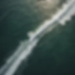 Aerial view of kite surfers riding waves