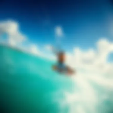 Kiteboarder catching the wind above a turquoise sea