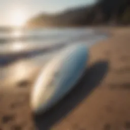 Used foil surfboard on the beach showcasing its unique shape