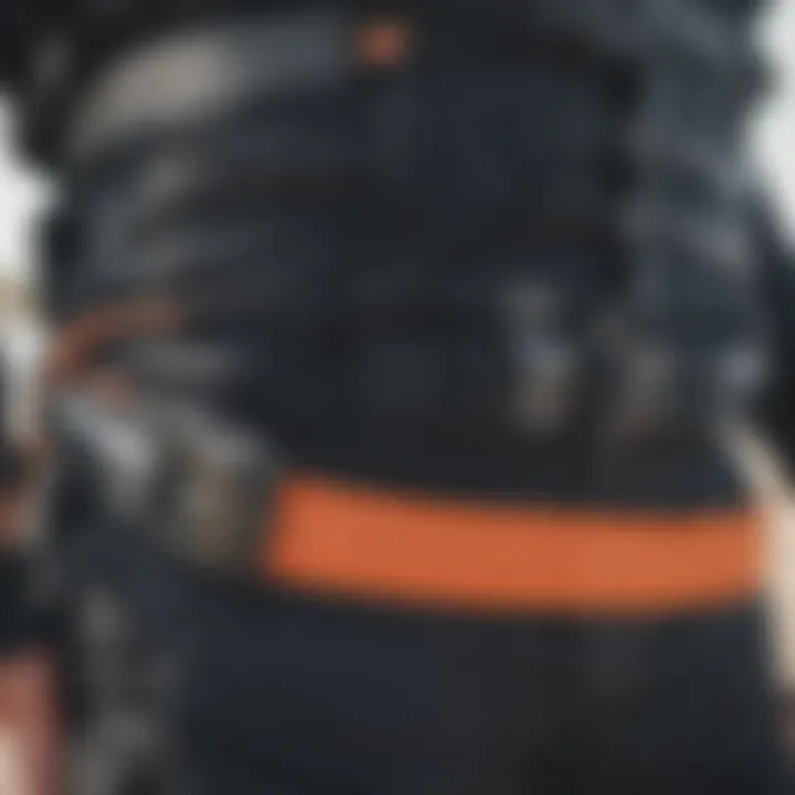 A detailed view of a waist leash designed for kiteboarding, showcasing its attachment mechanism and safety features.