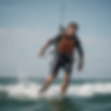 Kiteboarder in Action with Waist Leash A kiteboarder in action, demonstrating the use of the waist leash while riding on water.