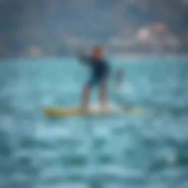 Person demonstrating foil SUP boarding technique on calm waters