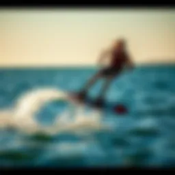 A dynamic foiling wakeboarder gliding above the water surface