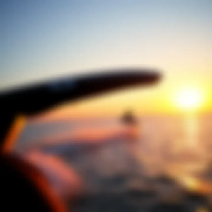 Sunset Wingboarding Experience A serene sunset view with a wingboarder in the distance