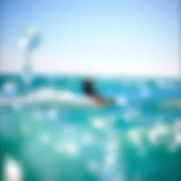 A stunning view of a foil kitesurfer gliding above the water