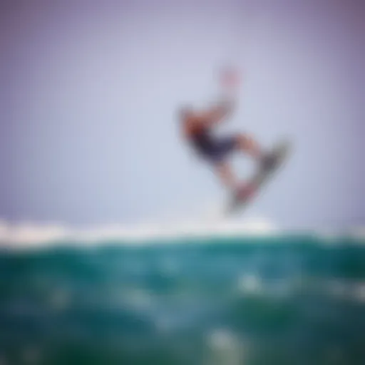 A kiteboarder executing a freestyle trick above the waves