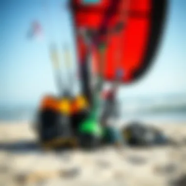 A collection of high-performance kiteboarding gear displayed on a sandy beach