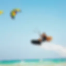 Dynamic kiteboarding action with vibrant kites against a clear sky