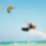 Dynamic Kiteboarding Action Dynamic kiteboarding action with vibrant kites against a clear sky
