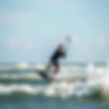 Kiteboarder navigating waves under a strong breeze