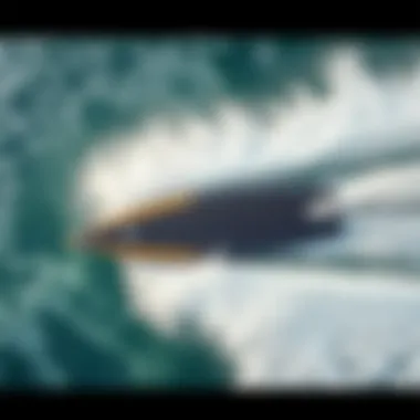 Aerial View of Hydrofoil Surfboard in Action Aerial view of a hydrofoil surfboard cutting through waves