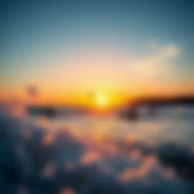 Kite surfers navigating the waves amidst a stunning sunset