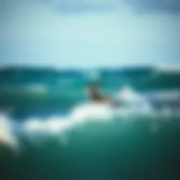 A kiteboarder navigating through waves, showcasing skill and control.