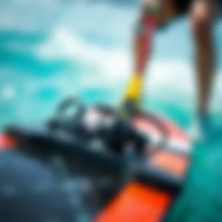A close-up of a kiteboard with bindings