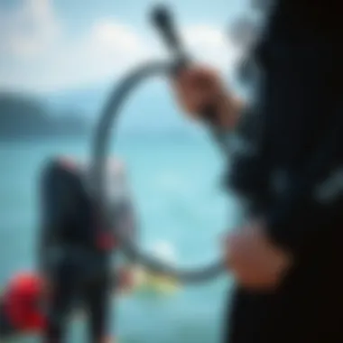 A kiteboarder preparing their gear with a focus on the sup pump hose