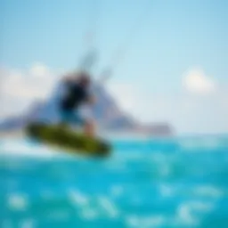 A vibrant kitesurfer gliding over turquoise waters
