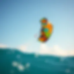 A vibrant kitesurfing kite soaring high above the ocean waves
