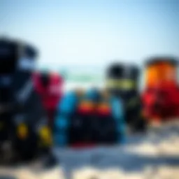 A variety of kitesurfing life jackets displayed on a beach