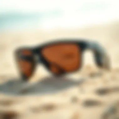 Durable sunglasses frame on sandy beach background