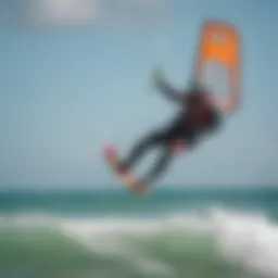 Kiteboarder riding the waves with a vibrant kite