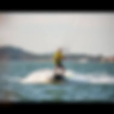 Ozone Wasp V2 on water with a rider