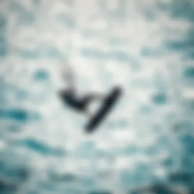 Kitesurfer Executing a Trick A kitesurfer performing a unique trick over a shimmering ocean