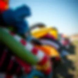 A vibrant collection of used kites in varying conditions, showcasing their potential for reuse