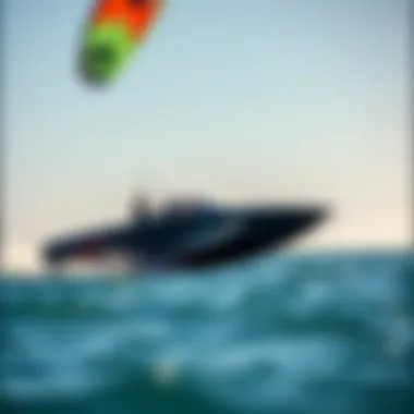 A sleek kite boat gliding across the water with a vibrant kite overhead