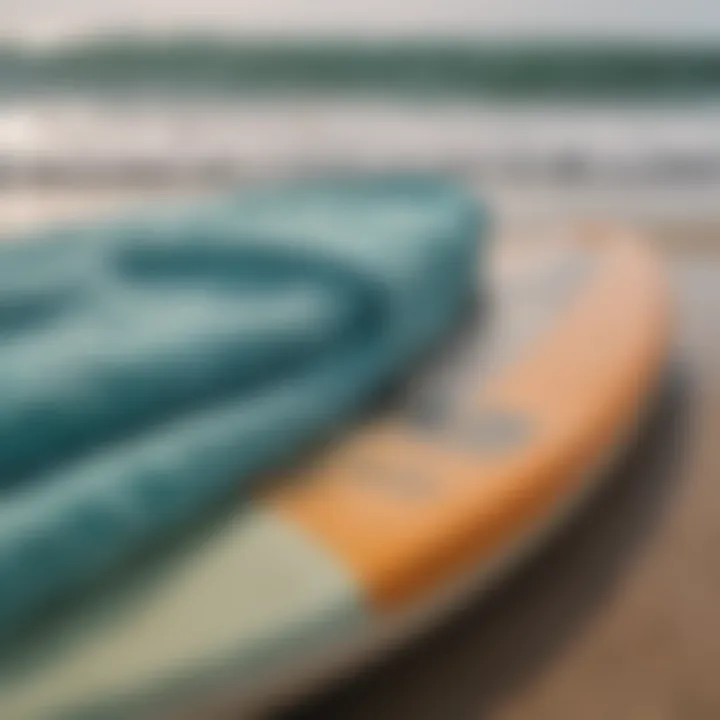 A soft and absorbent surf towel draped over a surfboard