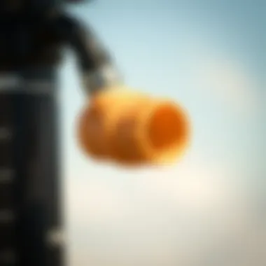 Demonstrating Compatibility with Kiteboarding Pumps Close-up of an adapter connected to a kiteboarding pump demonstrating compatibility